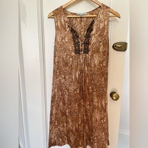 Silk dress with metal decorations.
